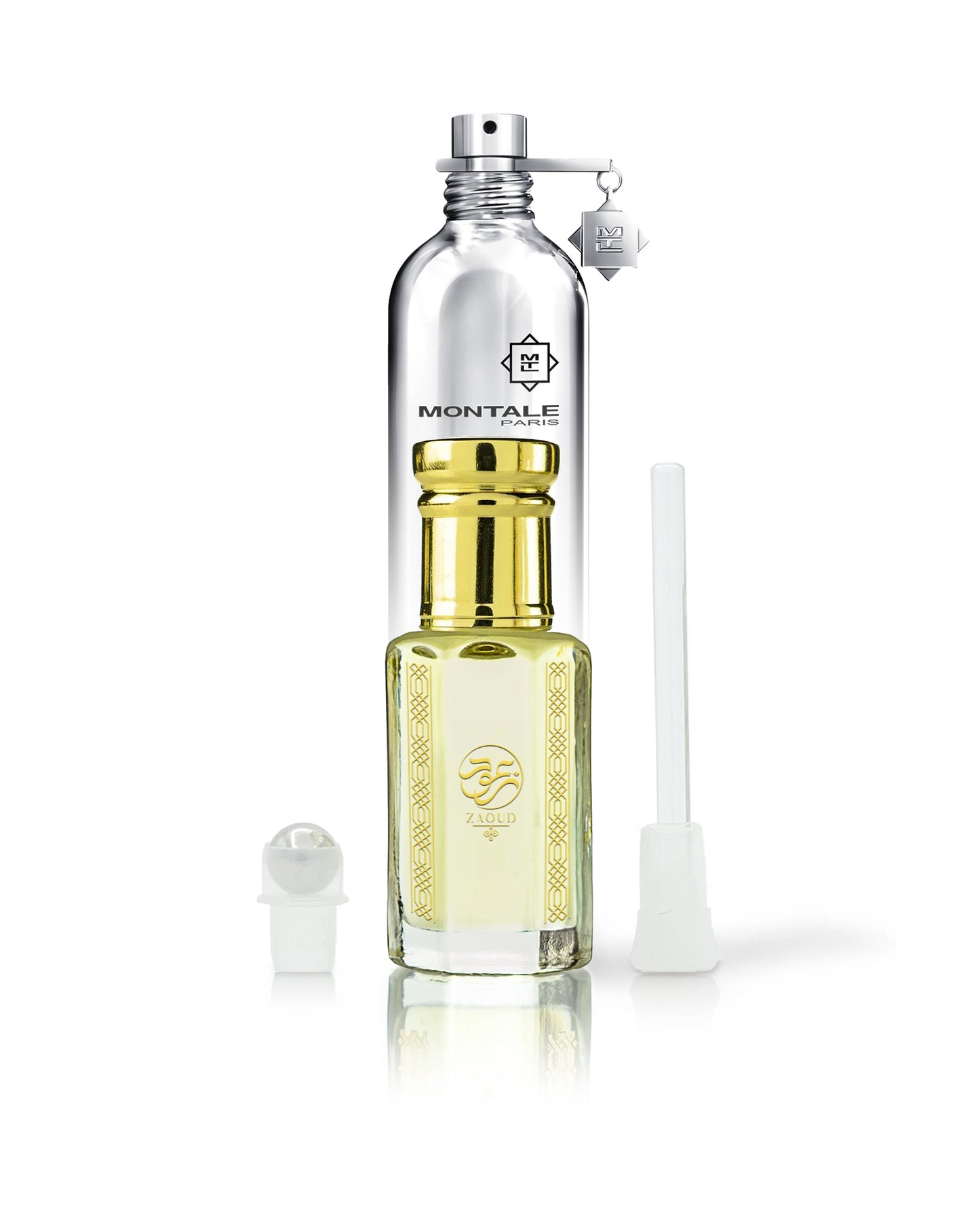 Cacao Royale Chocolate Greedy perfume oil bottle with montale bottle behind shows roller and stick besides against white background