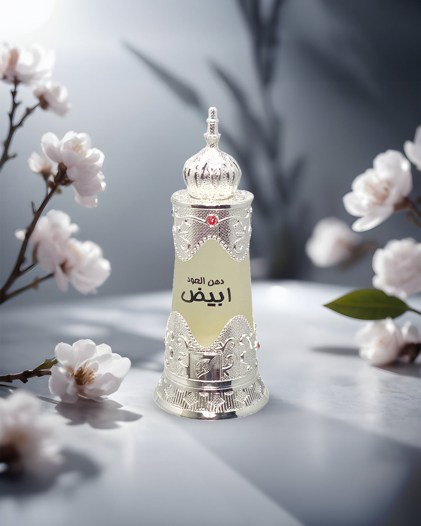 Dehn al oudh abiyad perfumed oil bottle photograph with white flowers