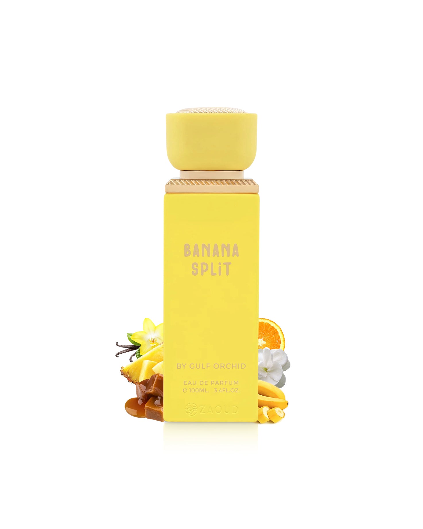 gulf orchid Yellow bottle of Banana Split perfume bottle surrounded by banana and caramel on a white background