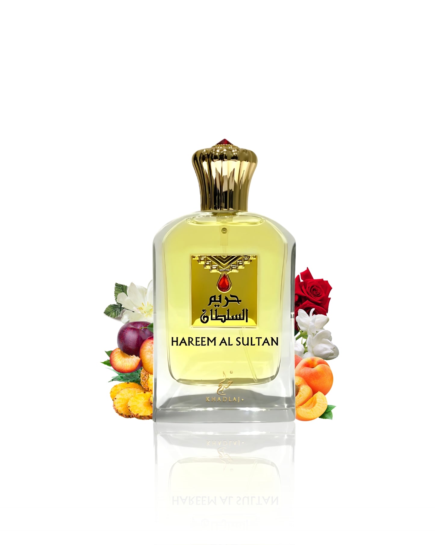 Hareem al sultan gold edp bottle surrounded by peach rose against white background