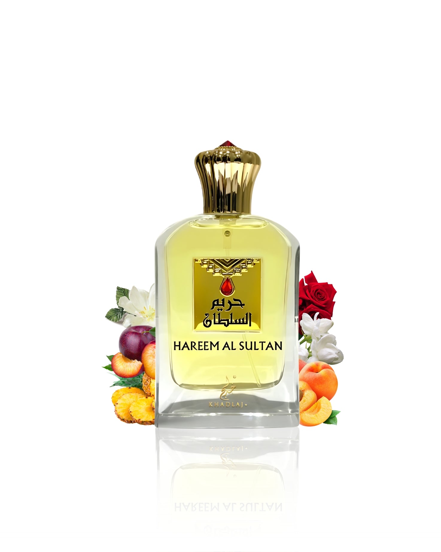 Hareem al sultan gold edp bottle surrounded by peach rose against white background