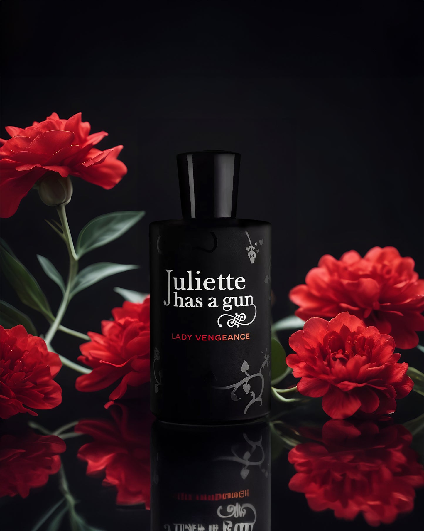 Lady Vengeance edp perfume bottle photograph besides red flowers