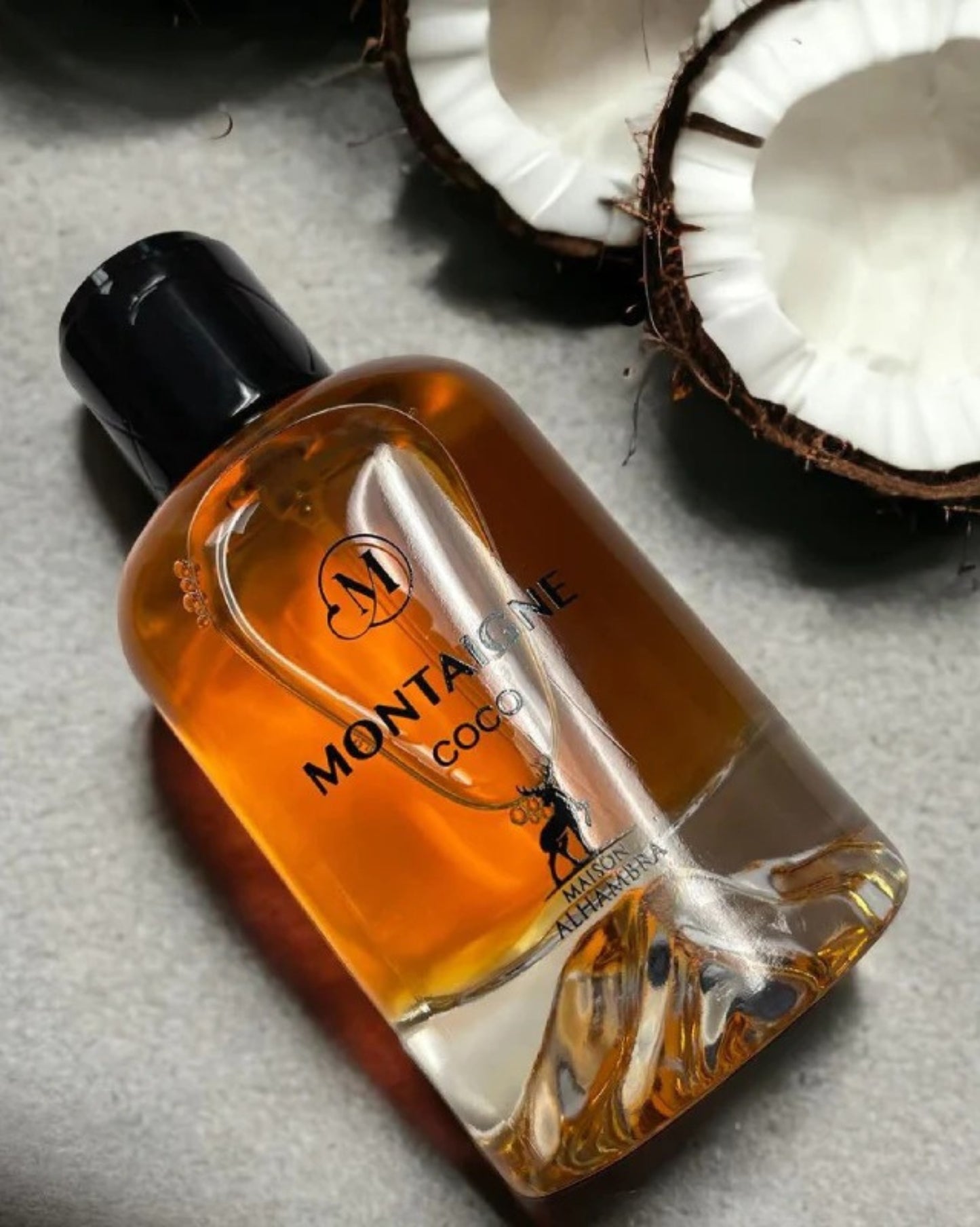 Montaigne coco perfume bottle photograph with piece of coconut