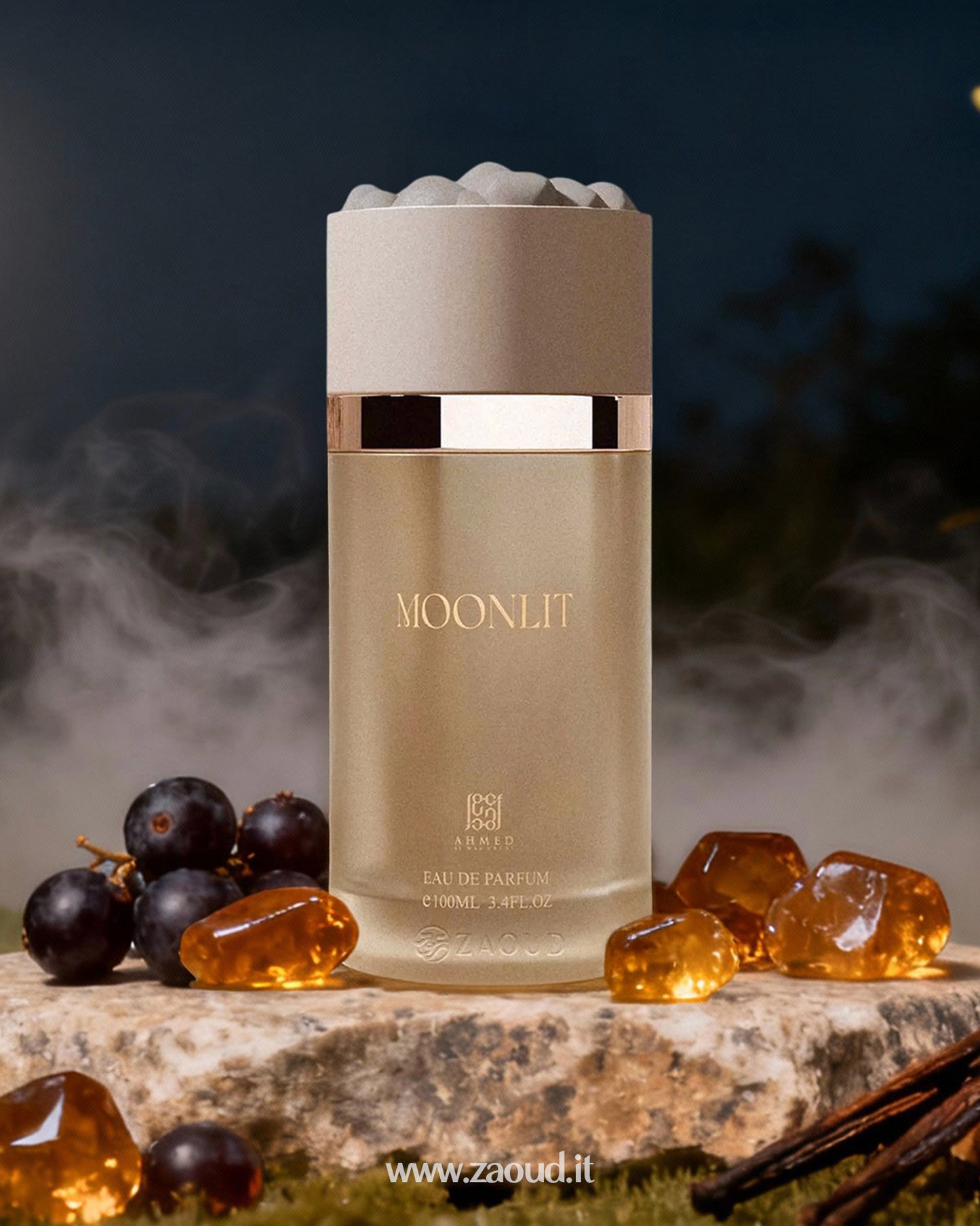 ahmed al maghribi moonlit perfume bottle photograph beside amber stones and Black Currants with smoke at background at night.