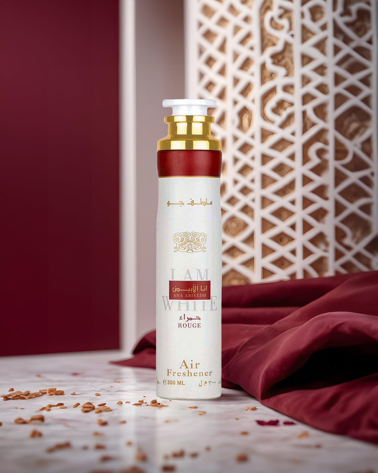 ana abiyedh rouge air freshner bottle photograph inside room besides red febric