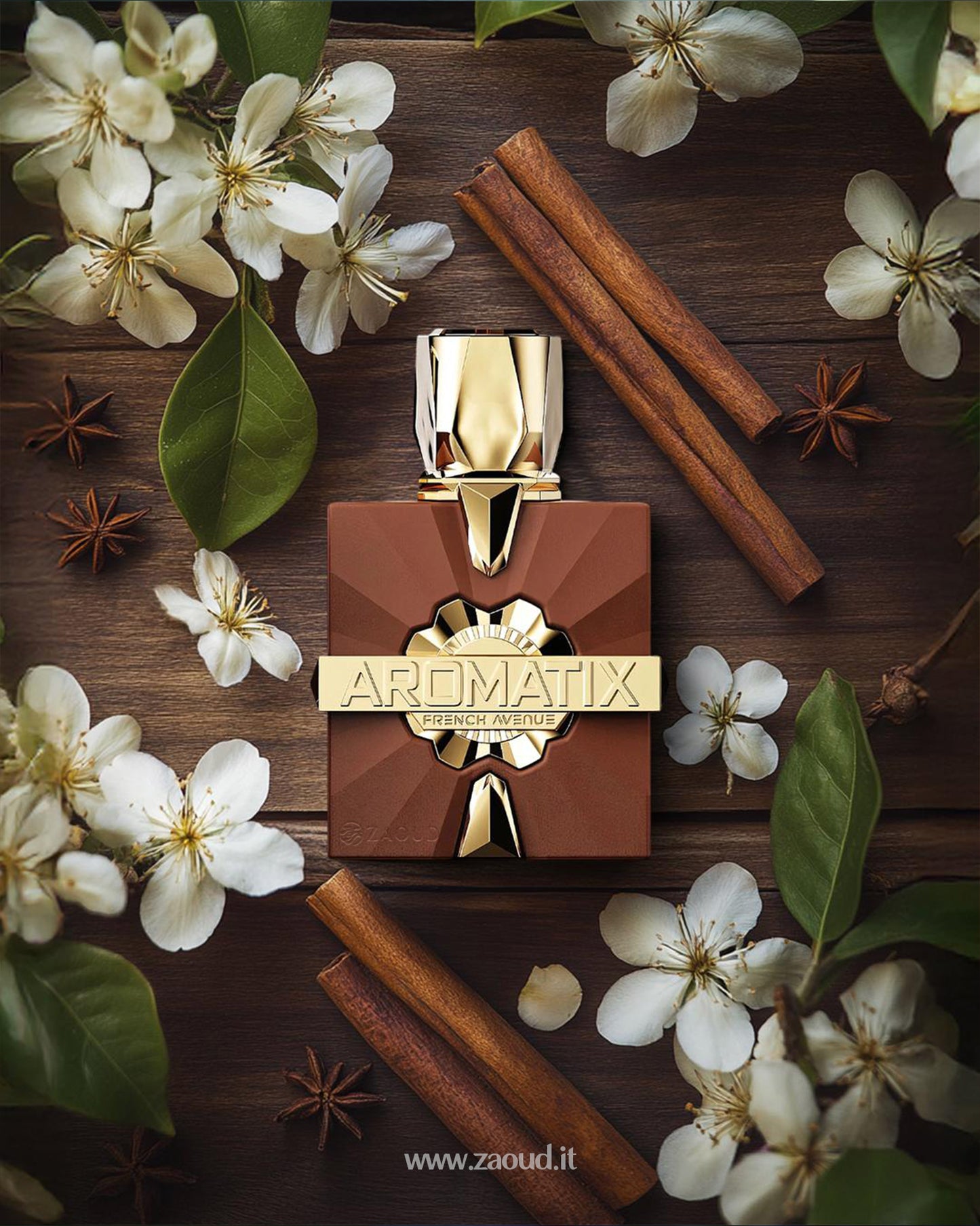 aromatix royal taboo perfume bottle photograph over wooden surface beside cinnamon stick and cinnamon sticks and anise around