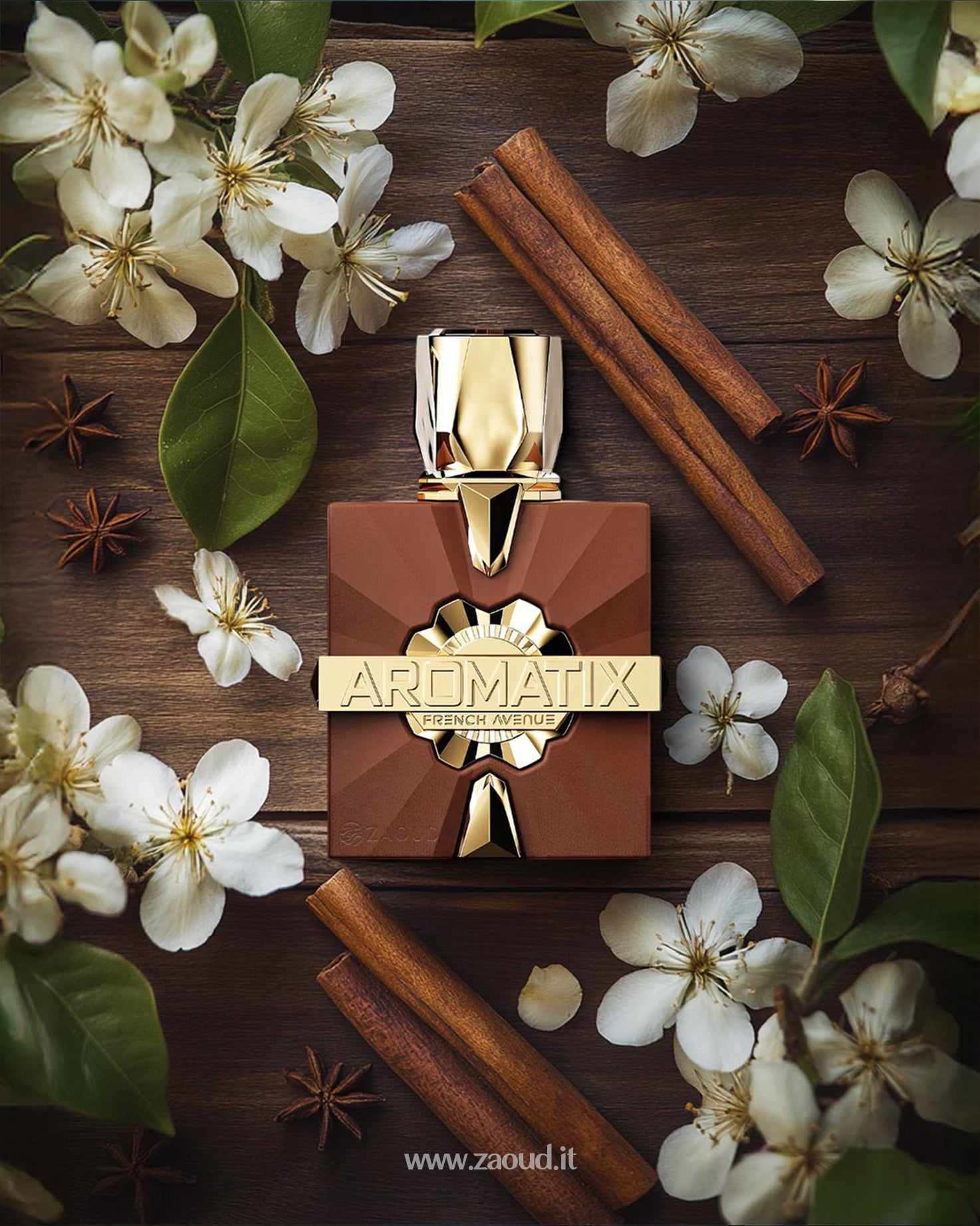 aromatix royal taboo perfume bottle photograph over wooden surface beside cinnamon stick and cinnamon sticks and anise around