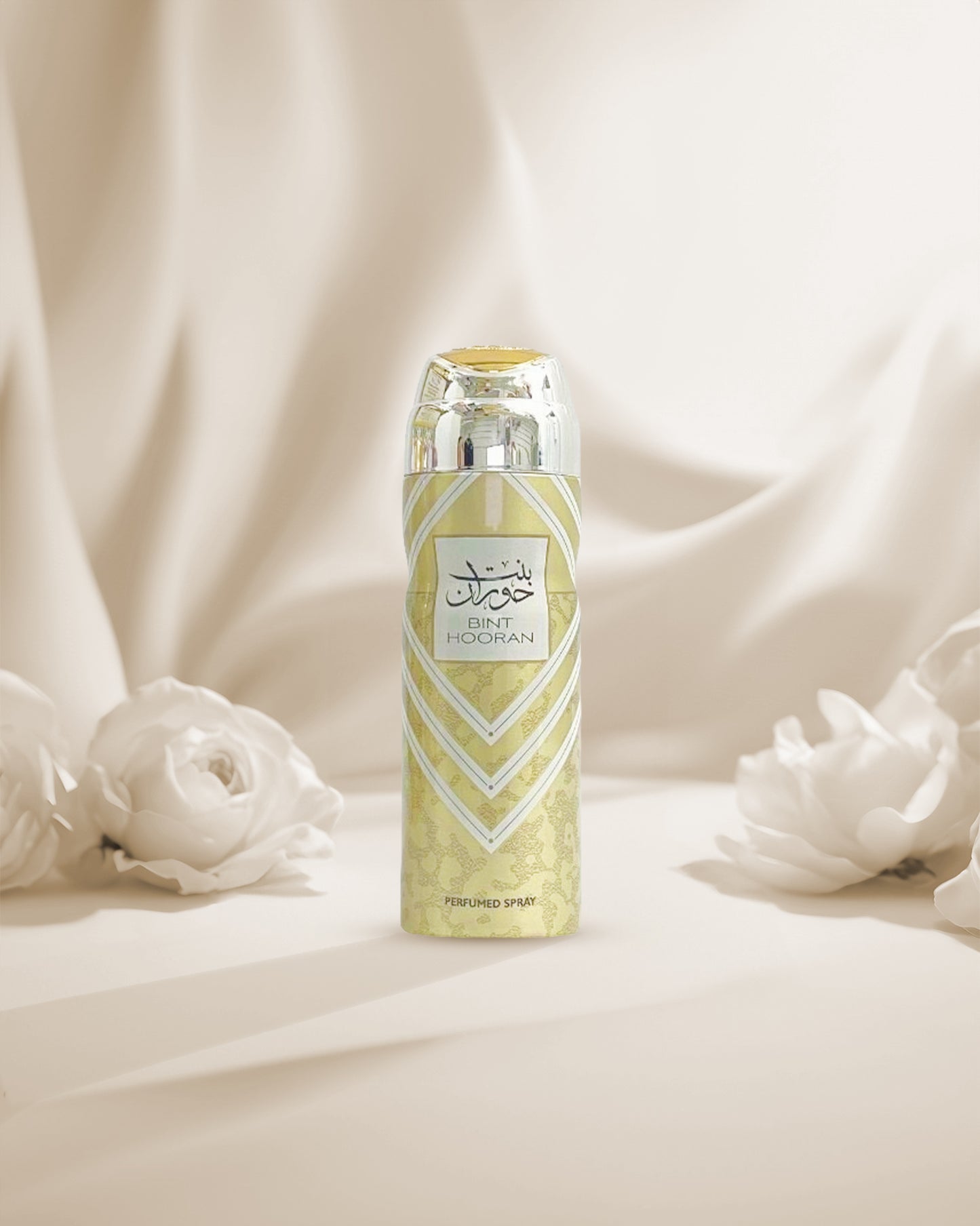 bint hooran Deodorant bottle photograph against white fabrics