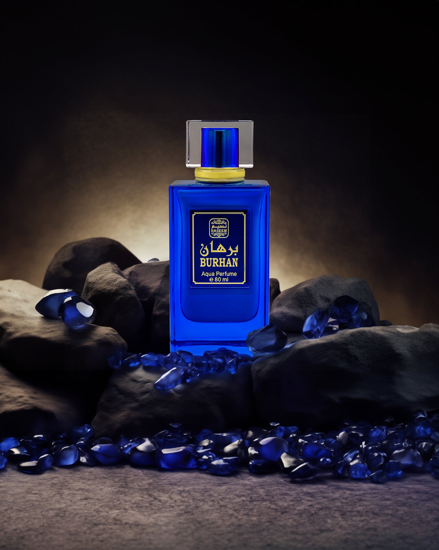 burhan aqua parfum bottle photograph surrounded by blue gems and rock