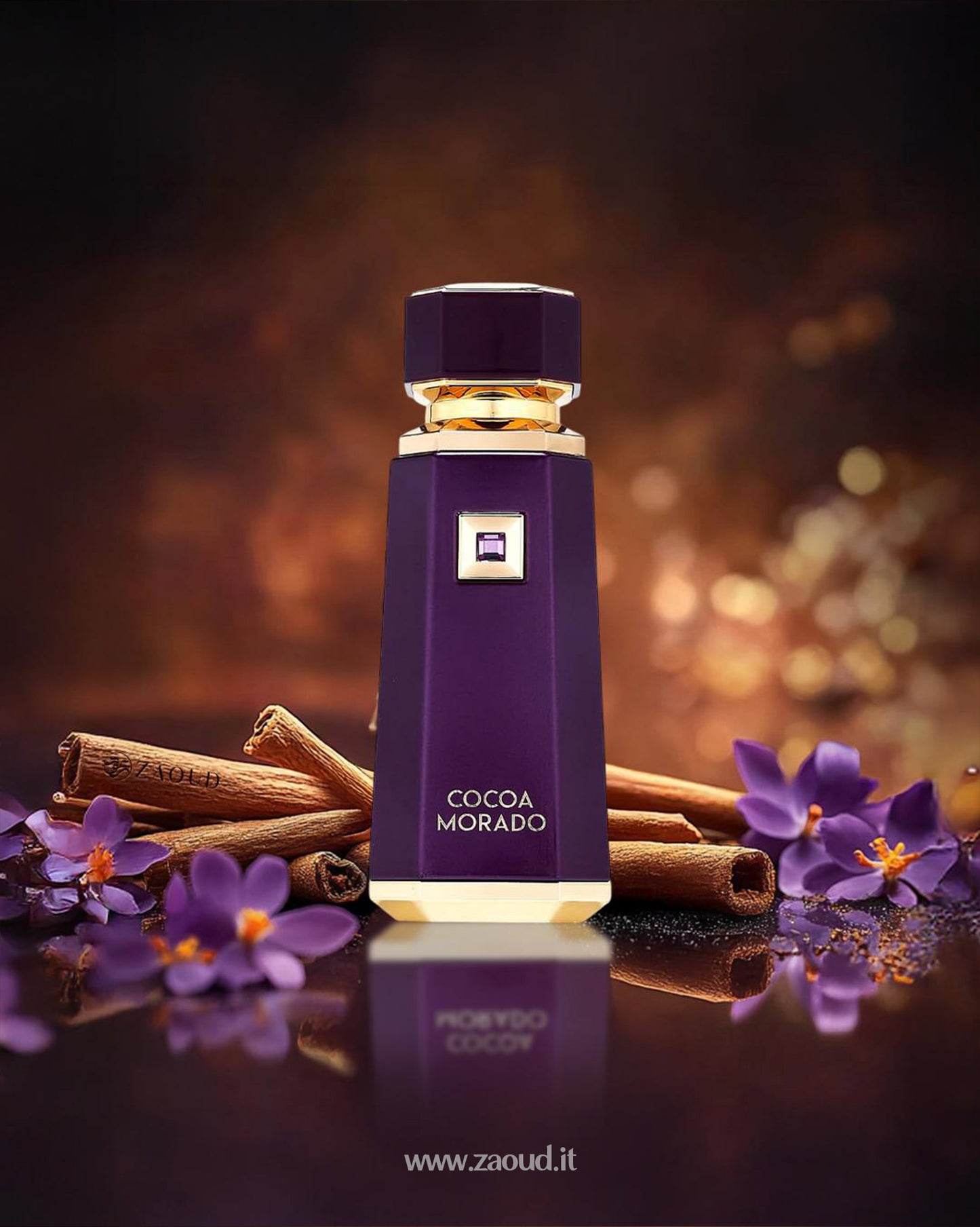 french avenue cocoa morado perfume bottle photograph over reflected surface besides saffron flowers and cinnamon sticks against blurry background