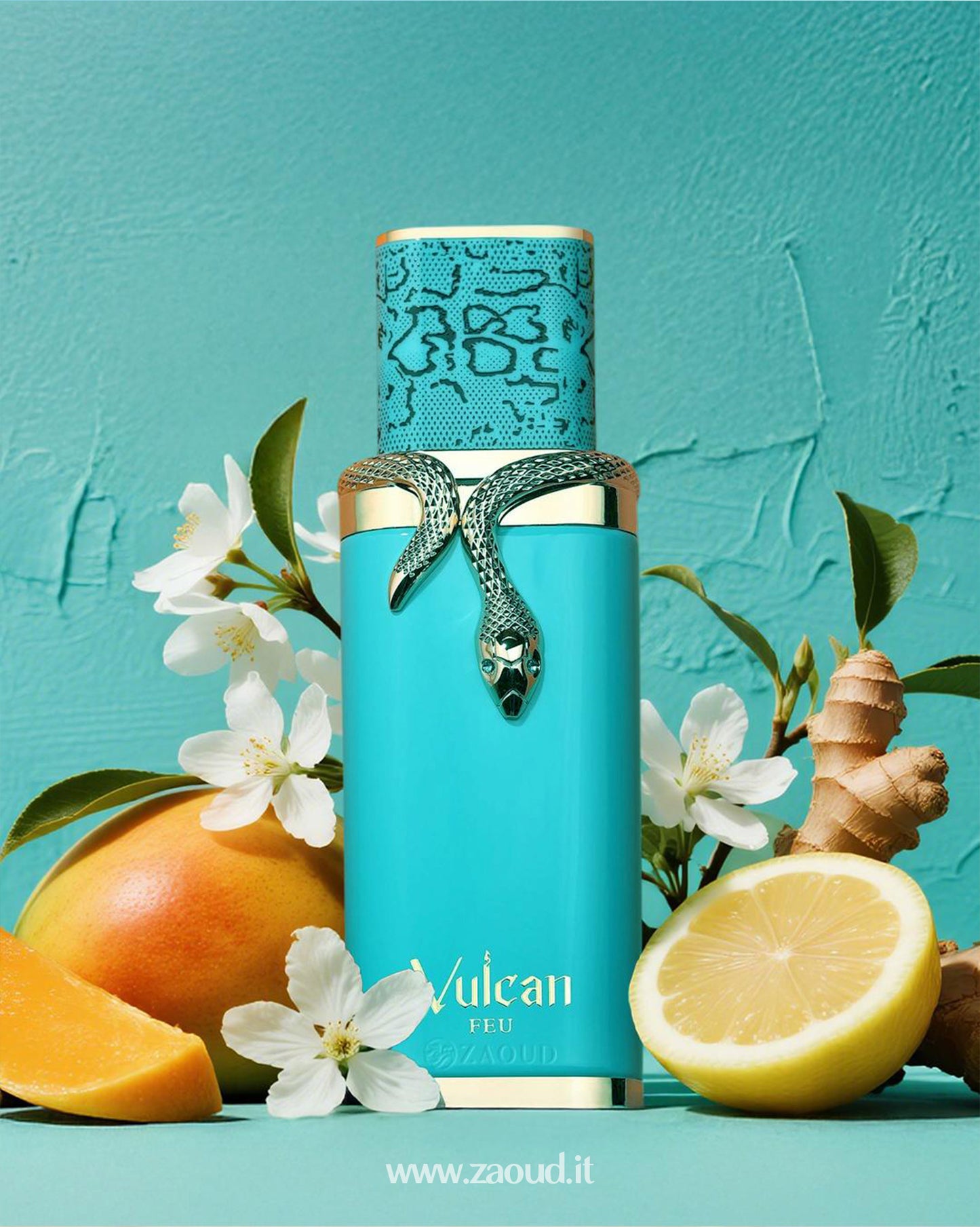 Turquoise perfume bottle of Vulcan Feu by French Avenue, decorated with a golden snake, surrounded by mango slices, lemon, ginger root, and white flowers, on a matching turquoise background.