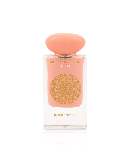 gulf orchid toffee Perfume bottle with pink cap and body on a white background