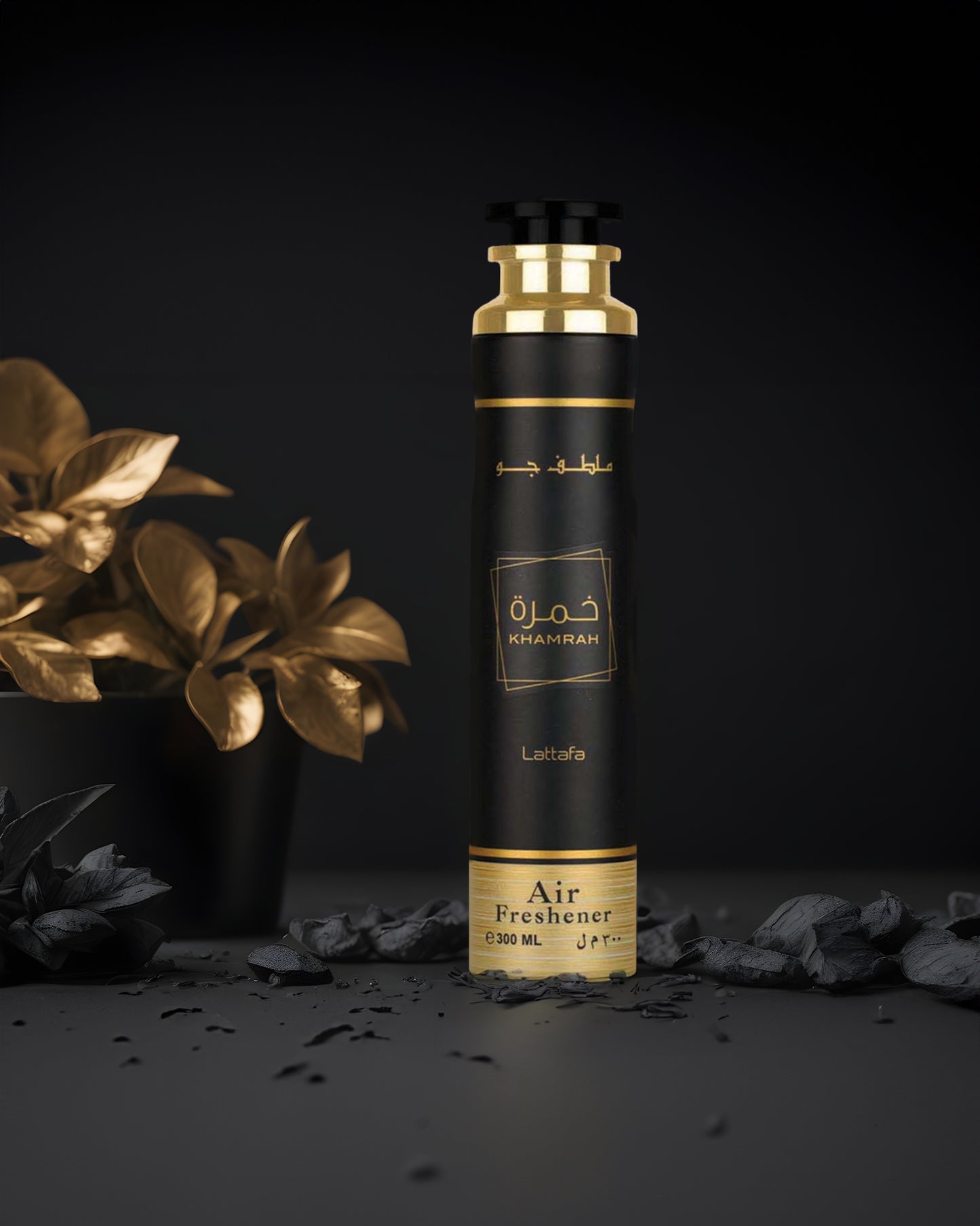 khamrah air freshener bottle photograph with golden leafs at background