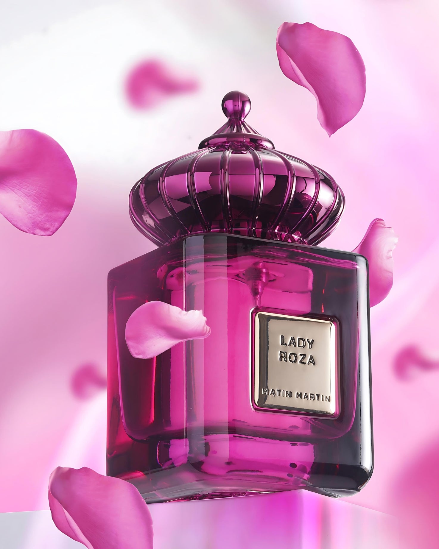 lady roza eau de parfum bottle photograph between rose petals