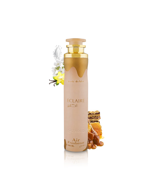 lattafa Eclaire Air freshener can with a warm beige body and amber cap, styled with honeycomb, beeswax flowers, and honey on a clean white background.