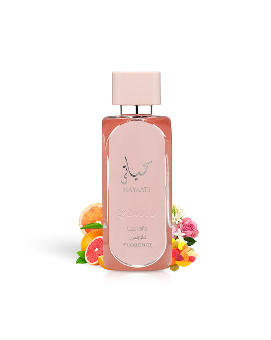 lattafa hayaati florence perfume bottle surrounded with fragranc enotes like fruits and floral shows against white background