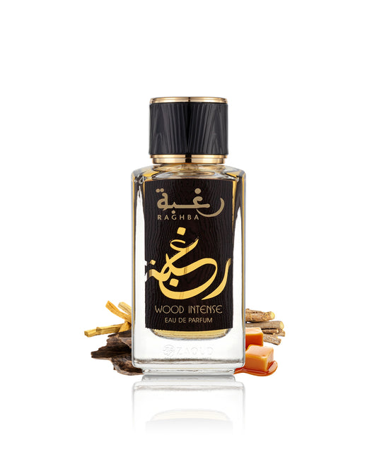 lattafa raghba wood intense, featuring a clear glass bottle with a black label and gold lettering, set against a white background with decorative dried spices.