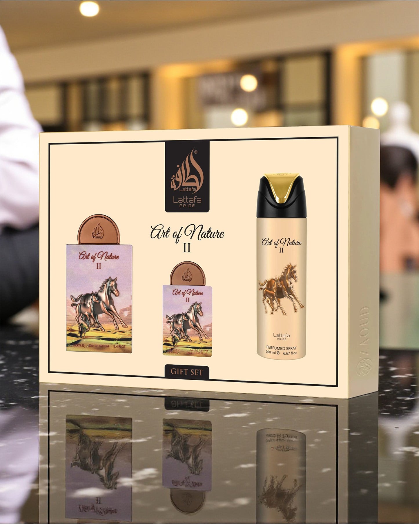 lattafa Art of Nature II gift set with a bottle boxe on a reflective surface.