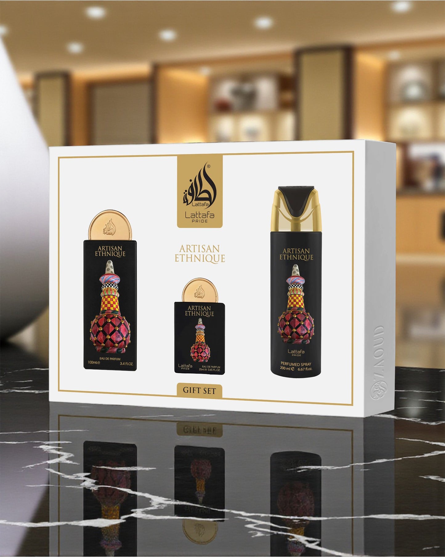 lattafa Artisan ethnique Gift set packaging with three bottles on a marble surface.