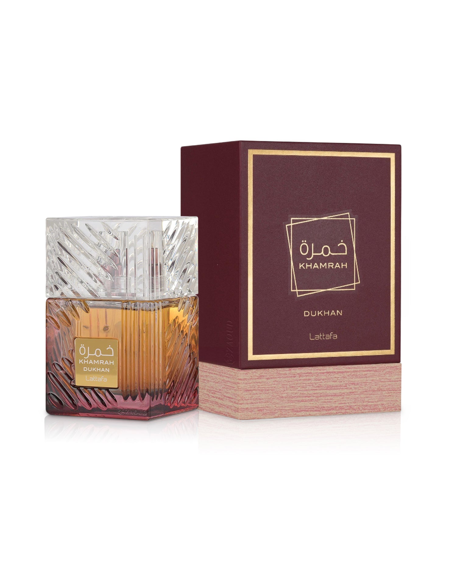lattafa khamrah dukhan perfume bottle shows beside its box against white background