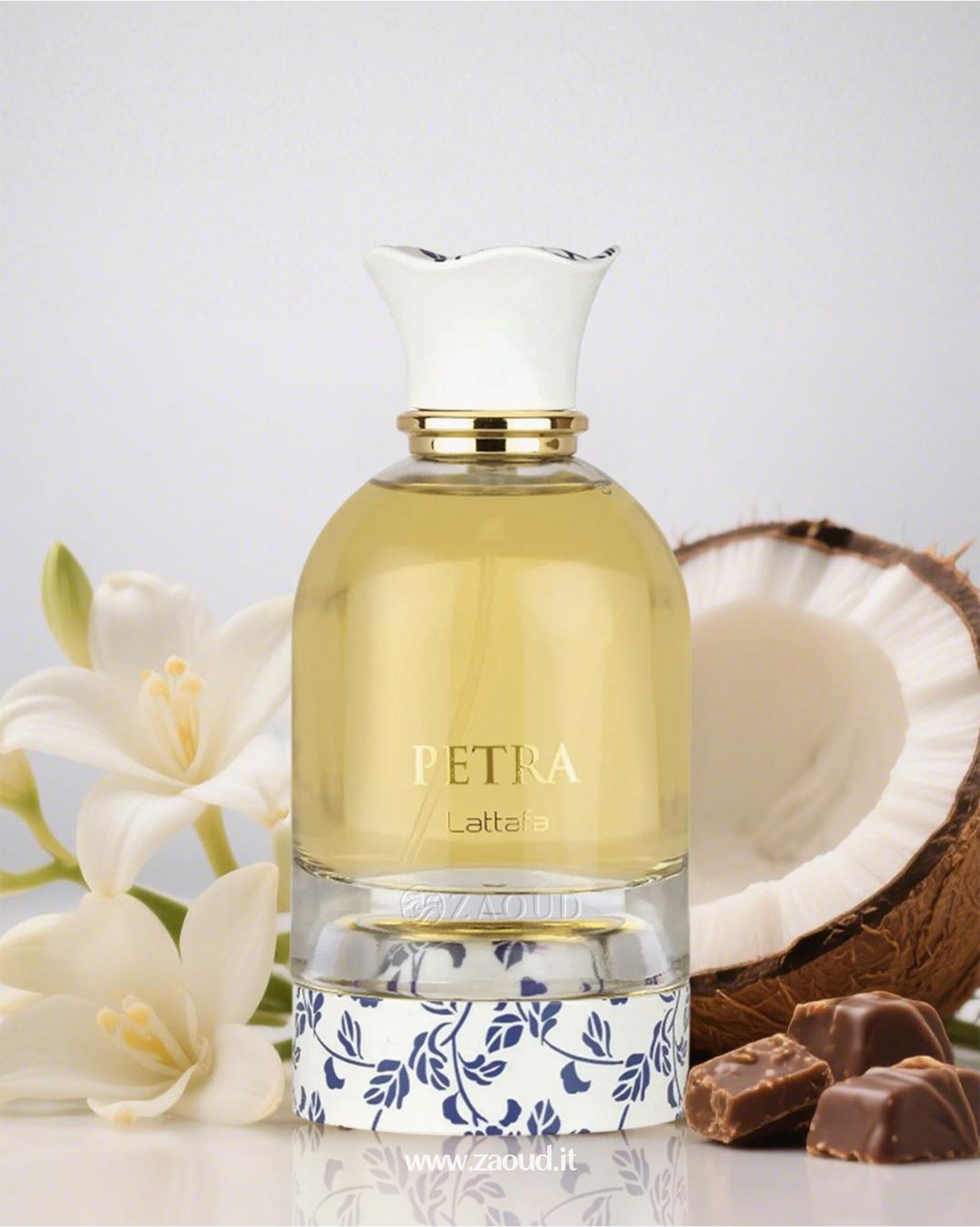 Petra Perfume by lattafa with coconut, chocolate, and floral notes. Elegant fragrance bottle surrounded by white lilies and coconut shell.