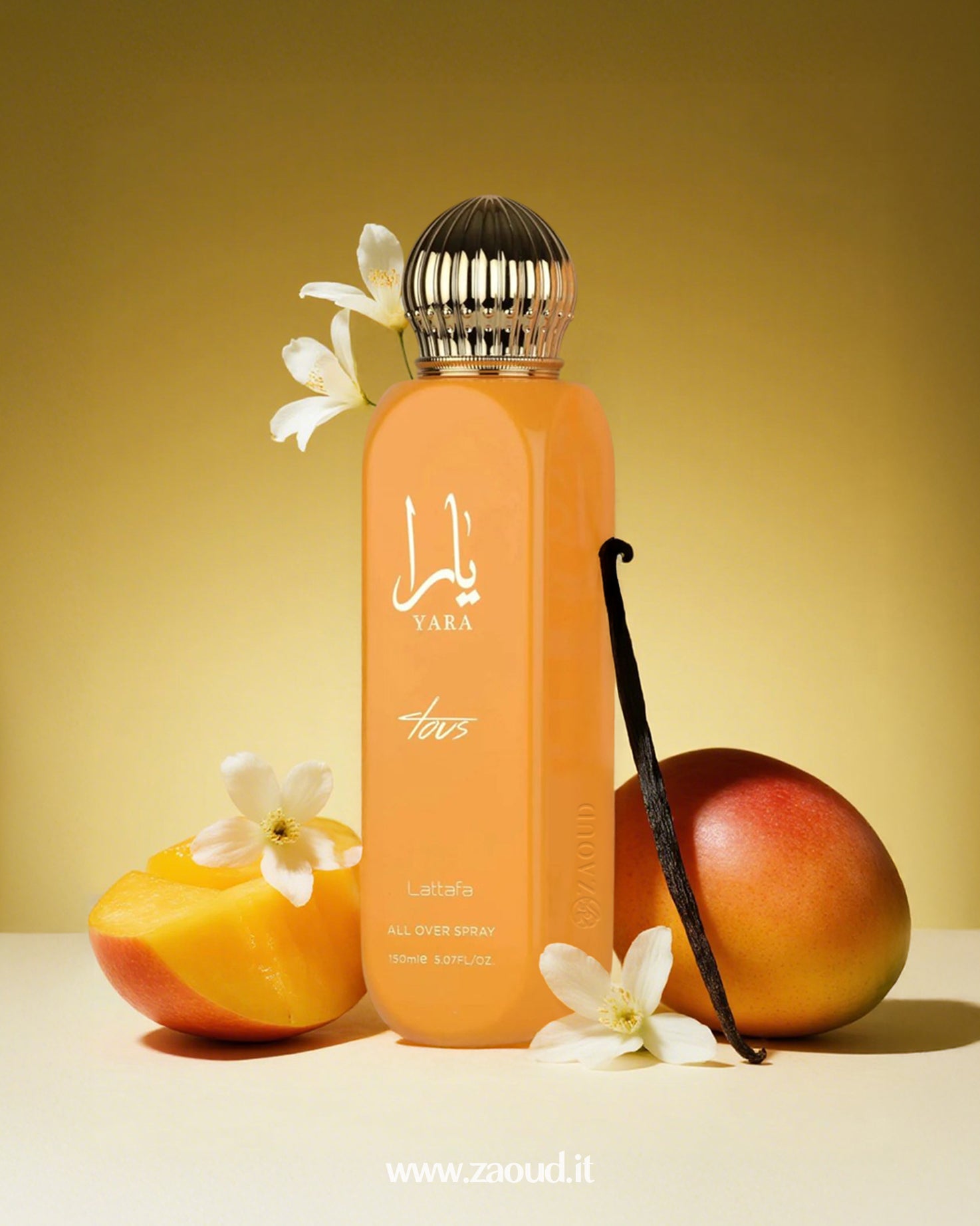 Yara Tous by Lattafa, surrounded by mango slices, white flowers, a vanilla bean, and a whole mango, on a yellow background.