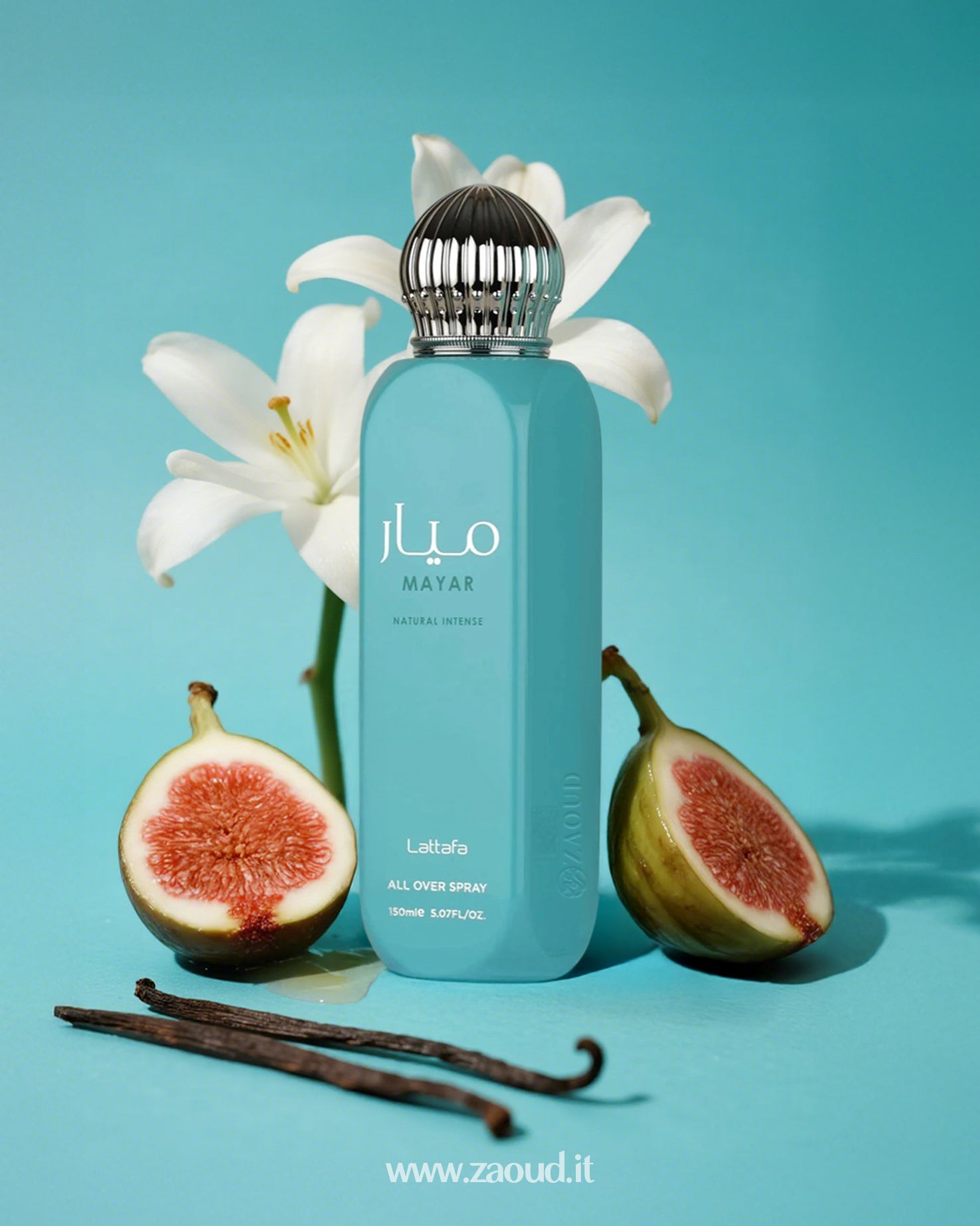 Lattafa Mayar Natural Intense All Over Spray, placed on a blue surface. Surrounding the bottle are vanilla sticks, fresh figs, and white flowers.