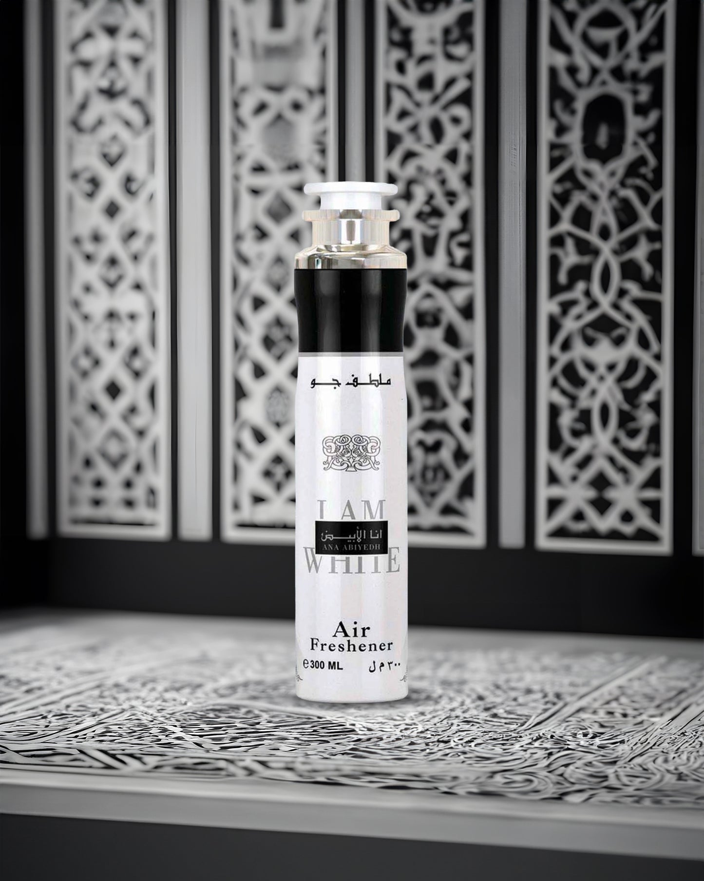ana abiyedh air freshner bottle photograph against abstract design background
