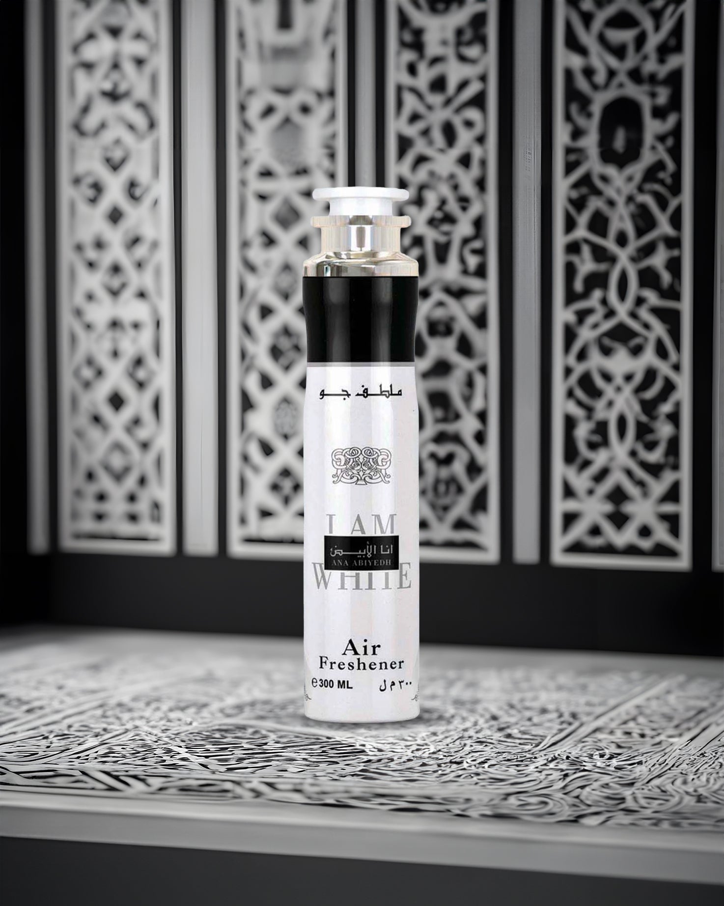 ana abiyedh air freshner bottle photograph against abstract design background