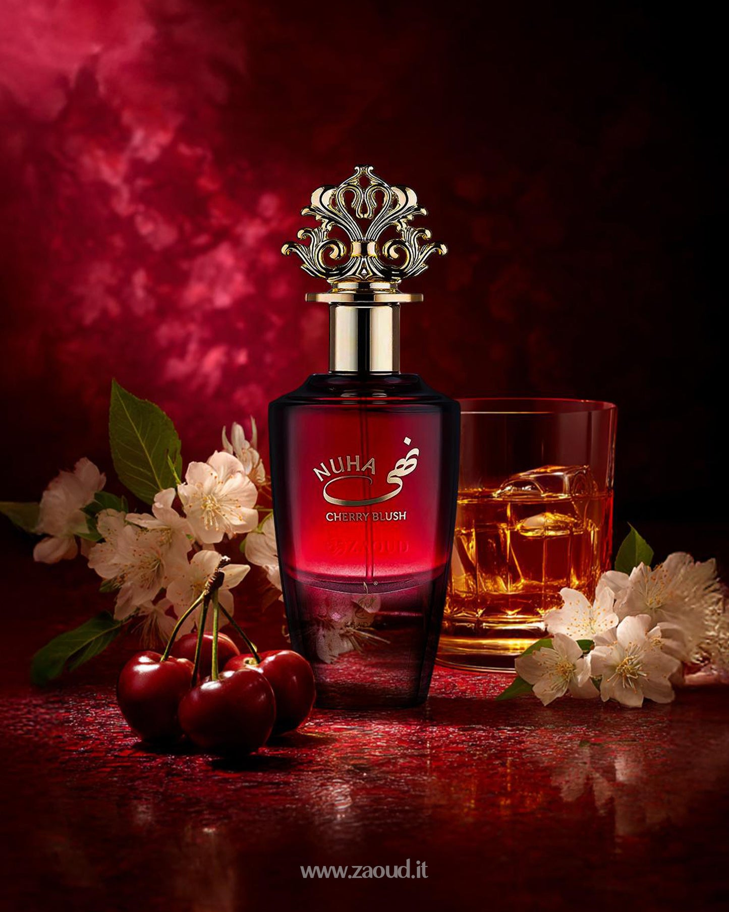 NUHA Cherry Blush by Khadlaj A luxurious cherry and floral perfume with a rich golden crown cap, set against a deep red background with cherries and a glass of whiskey, evoking warmth and elegance.