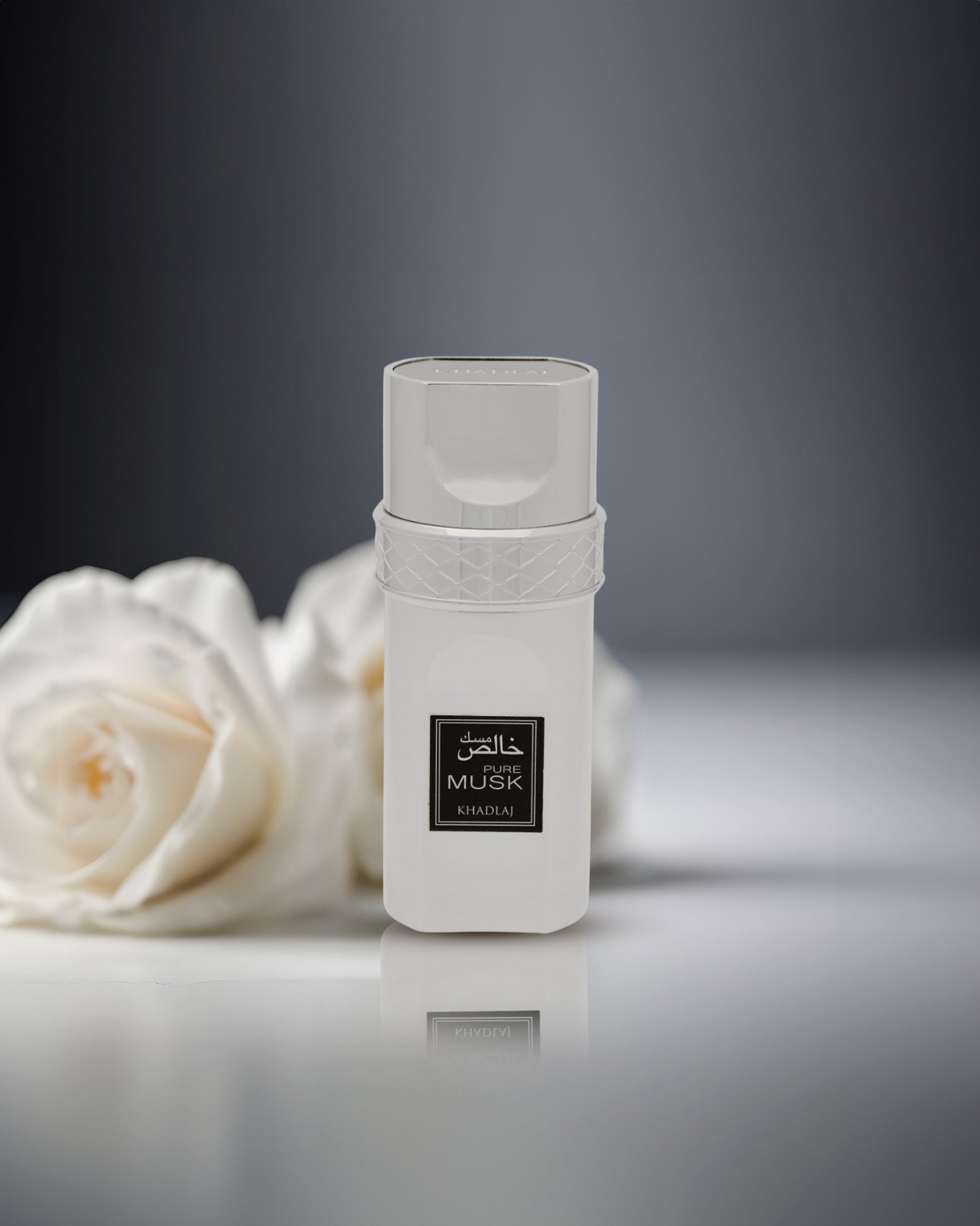 pure musk edp perfume BOTTLE photograph besides fressia flowers