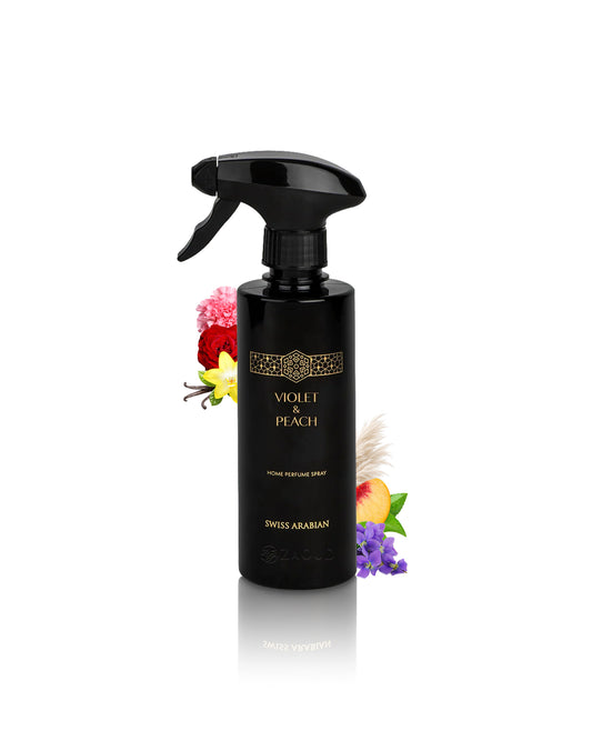 swiss arabian violet and peach home perfume spray bottle surrounded by rose and vanilla shows against white background