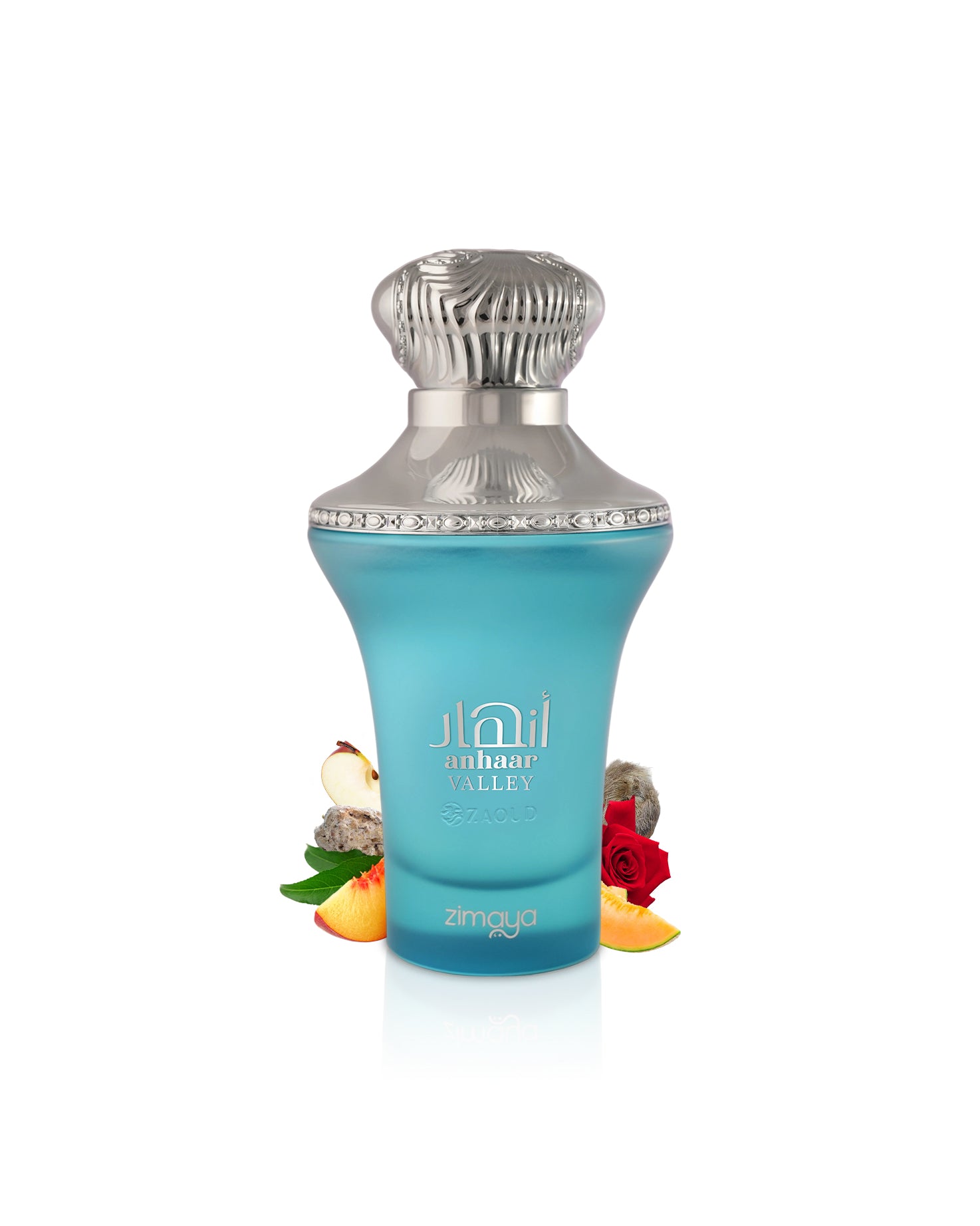 zimaya anhaar valley blue perfume bottle surrounded with fruits and rose with silver cap on a white background