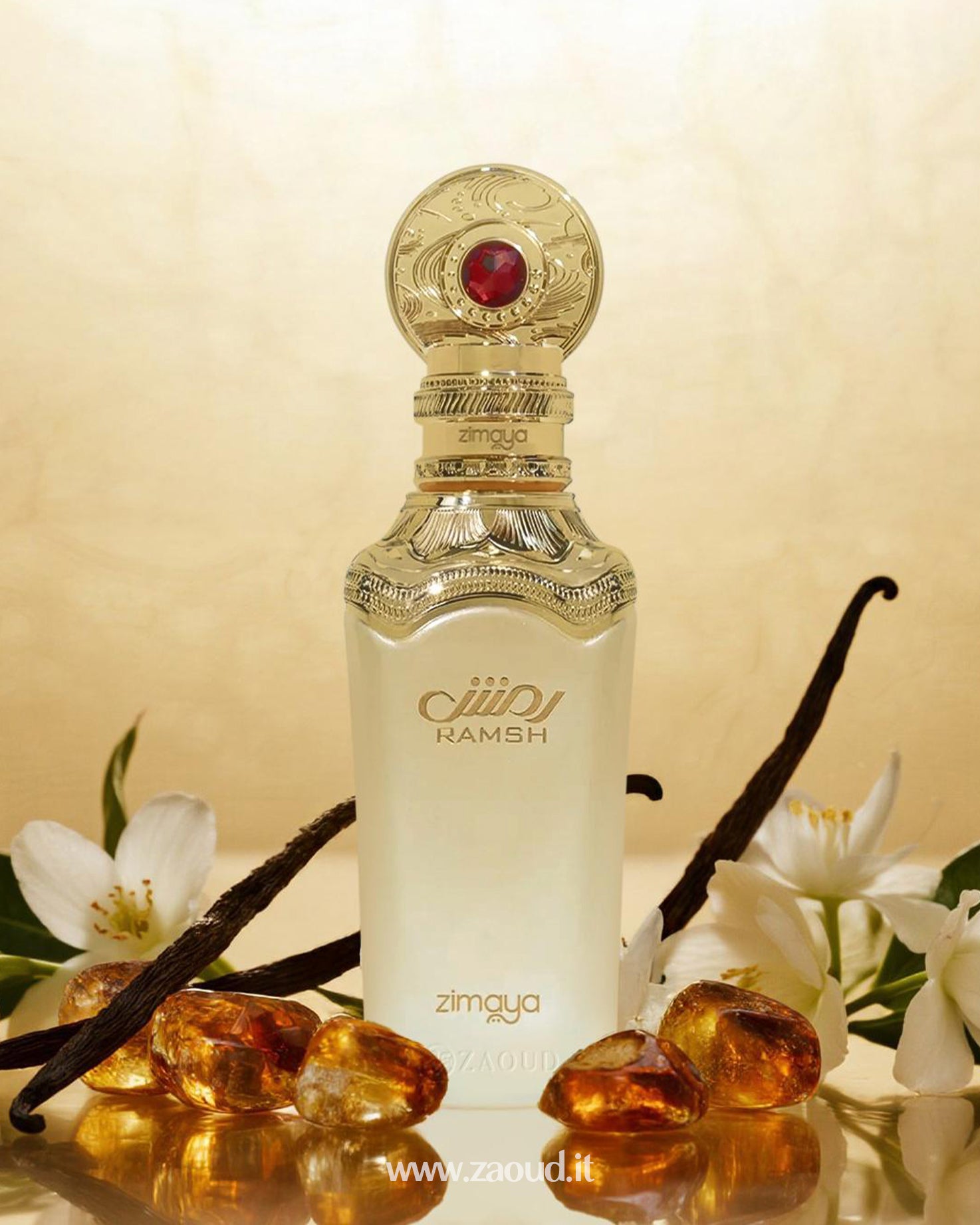 Zimaya Ramsh perfume bottle, surrounded by vanilla pods, white floral blossoms, and glowing amber stones, set against a soft golden background.