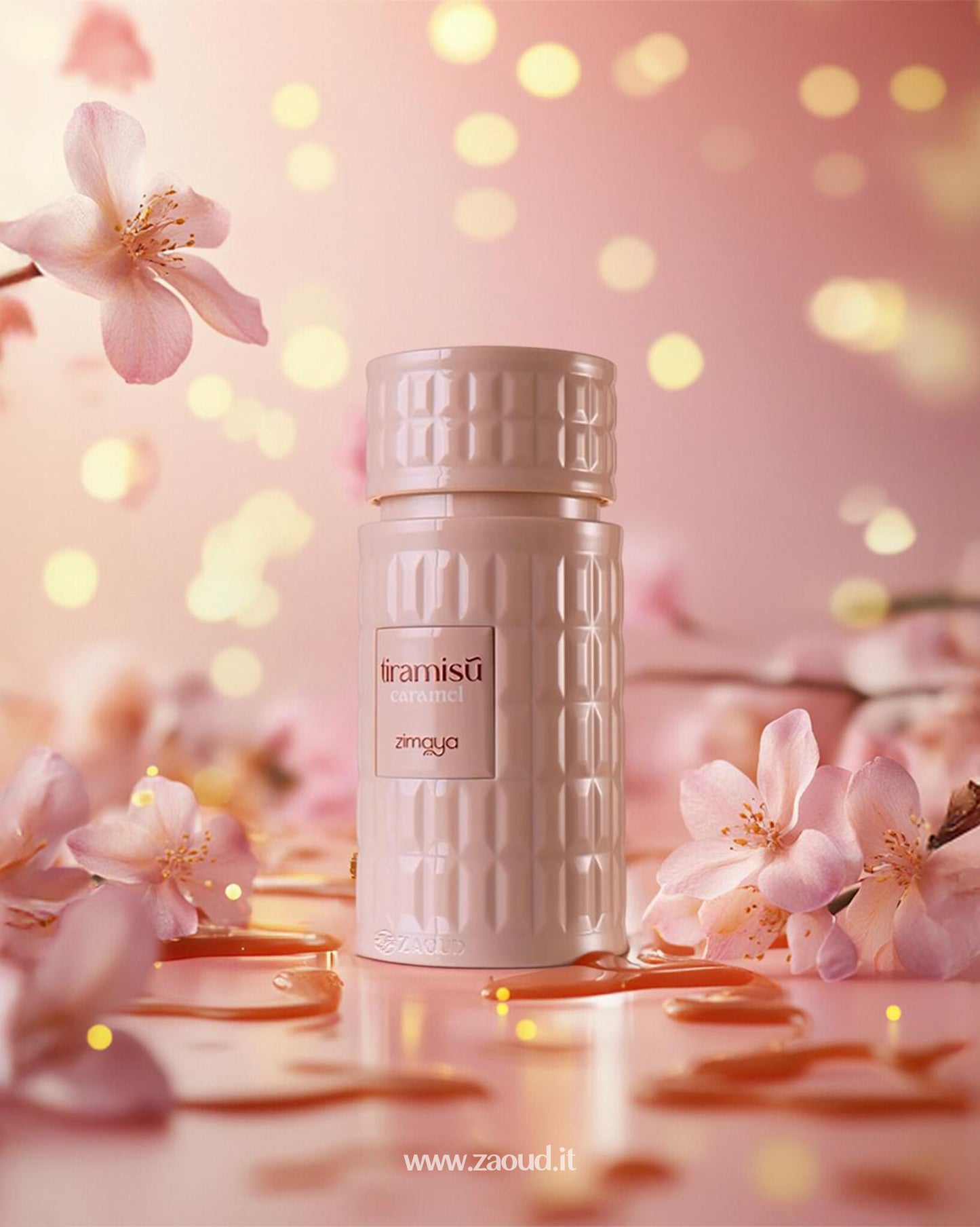 zimaya tiramisu caramel perfume bottle photograph over reflected surface eith liquid caramel and with Orchid flowers around