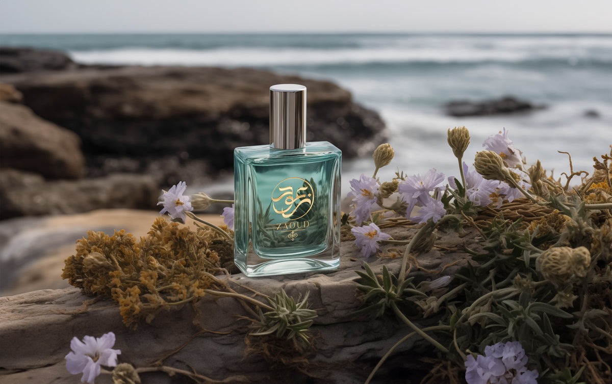 aquatic perfumes bottle infront of sea beach besides seaweed.