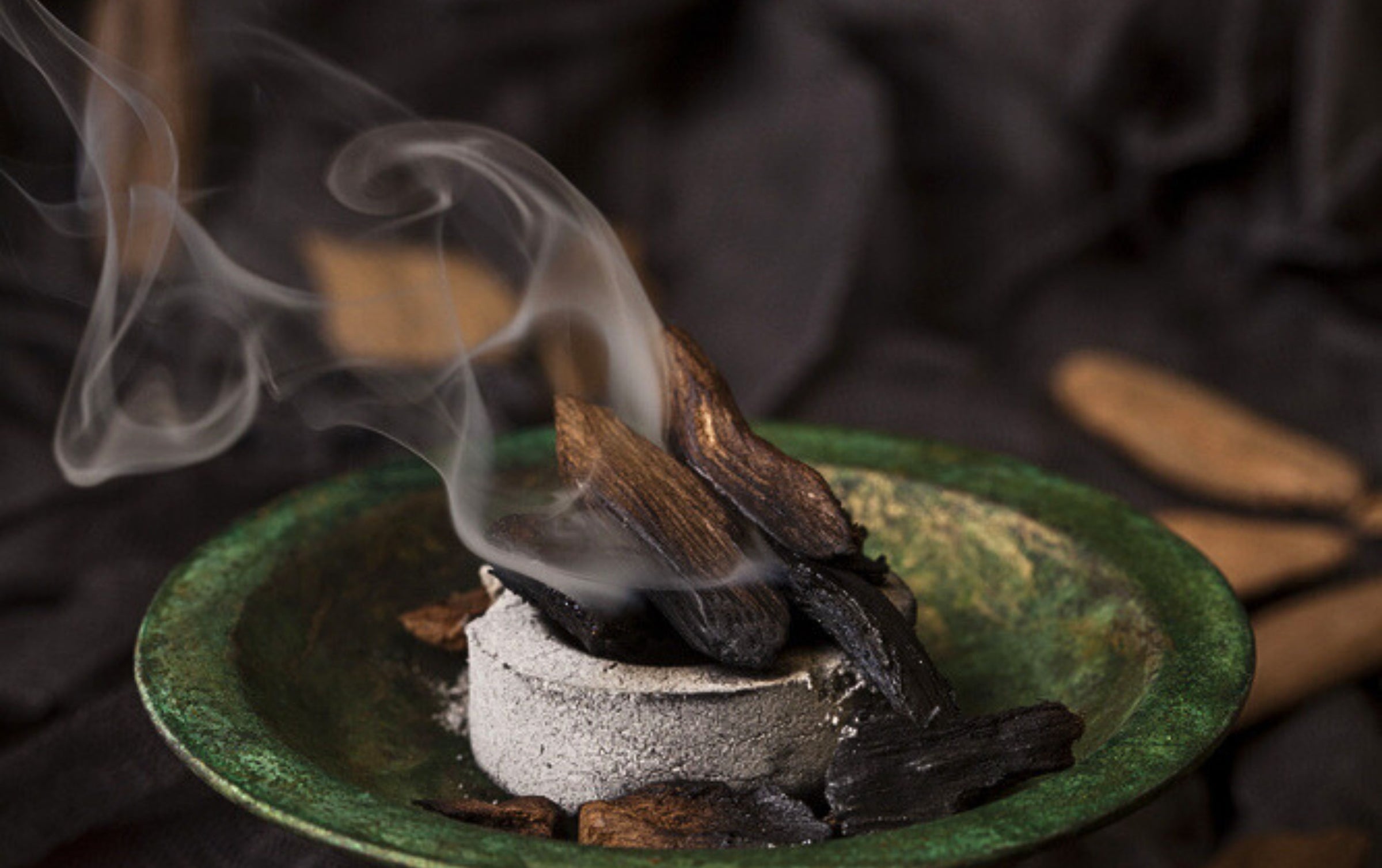 oud bakhoor incense burn over carbon.