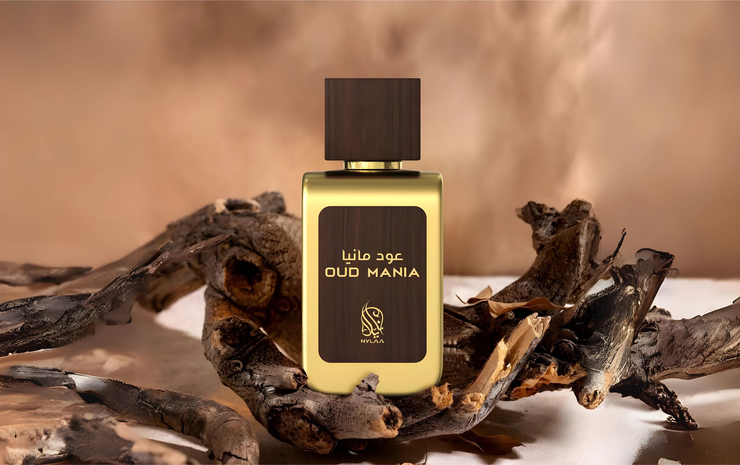 oud mania perfume bottle by nylaa photograph over a wood log.