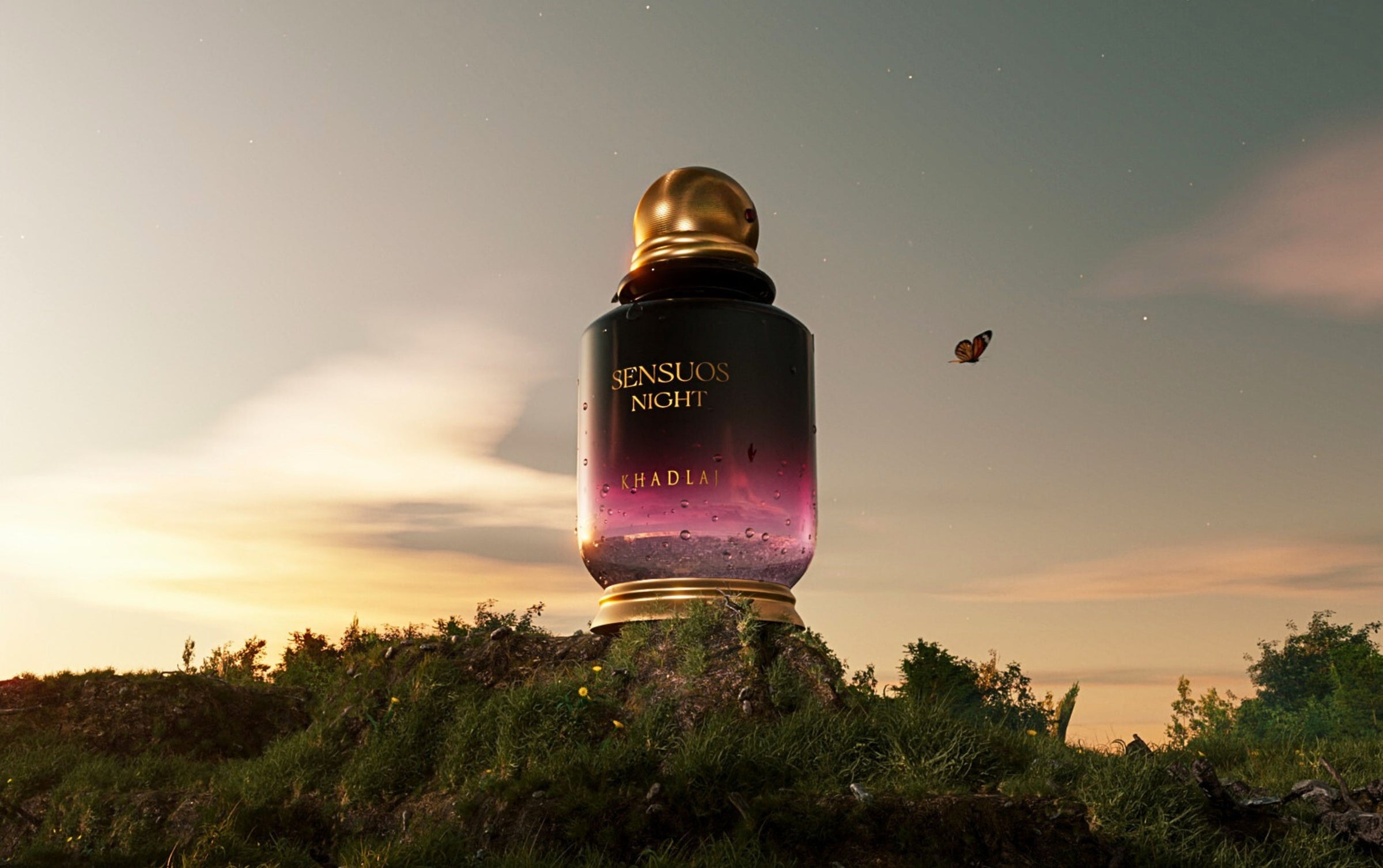 sensuous night perfume bottle by khadlaj over mountain against sunset.