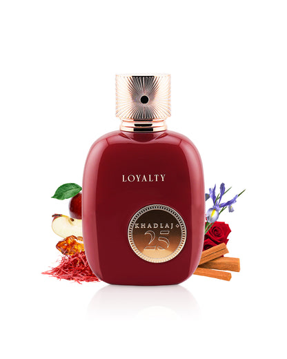 khadlaj 25 loyalty perfume bottle surrounded with its ingredients like apple and rose with many others shows from behind the bottle agianst white background