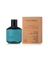 a chaos in the ocean perfume bottle shows beside its box against white background