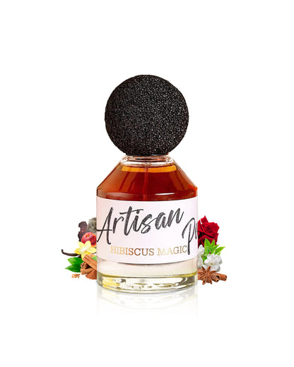 fragrance world HIBISCUS MAGIC ARTISAN PERFUMERY bottle surrounded with its ingredients like vanilla and anella beside many other like rose shows against white background