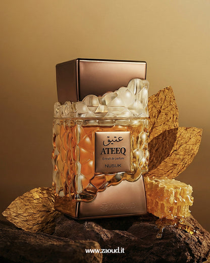 Ateeq perfume bottle with honeycomb and honey on a brown background