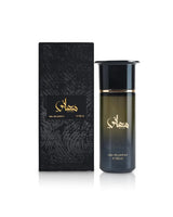 ahmed al maghribi maani perfume bottle beside box shows against white background