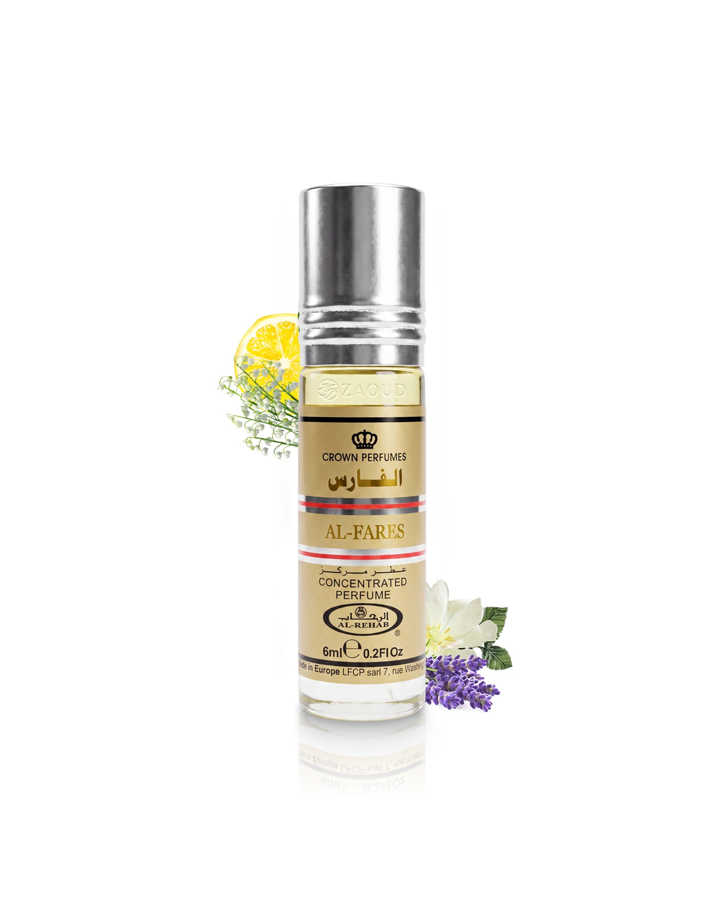 A bottle of Crown Perfumes Al-Fares Concentrated Perfume with a silver cap and a beige label, styled with a lemon slice, green sprigs, and white and purple flowers on a white background.