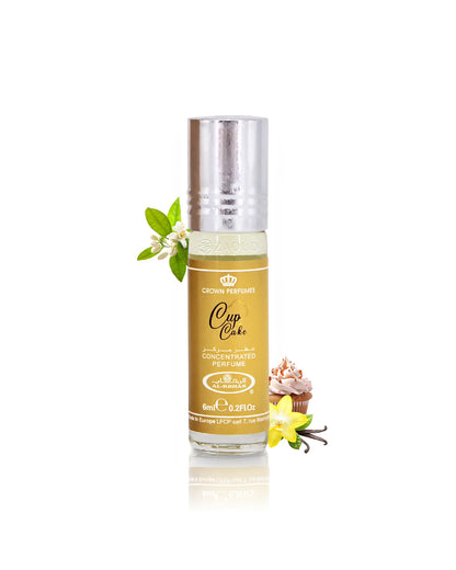 al rehab cup cake perfume oil bottle surrounded with fragrance notes like cupcake and vanilla shows against white background