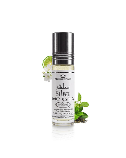 al rehab silver perfume oil bottle surrounded with fragrance notes like herb and citrus  shows against white background