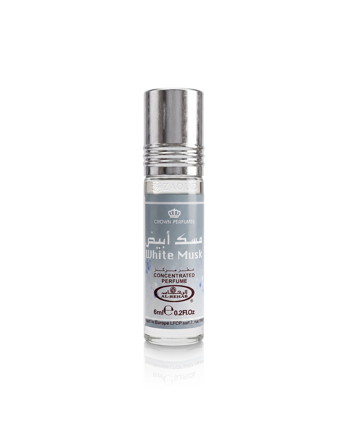 A roll-on perfume bottle labeled 'White Musk' by Crown Perfumes, featuring a silver metallic cap and a white label with gray text, set against a plain white background with a soft reflection below.