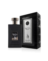 al absar hekma perfume bottle shows beside its box against white background