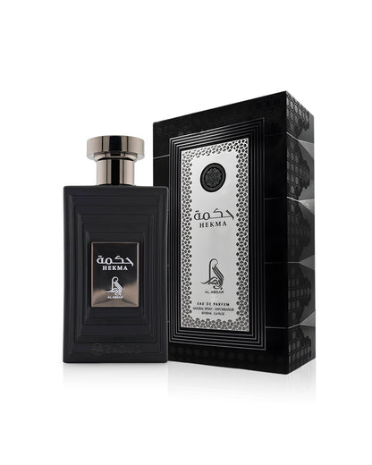 al absar hekma perfume bottle shows beside its box against white background